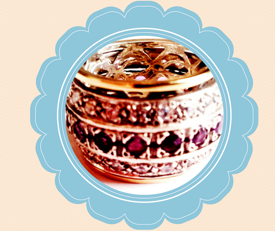 spinner ring made silver gold and garnets