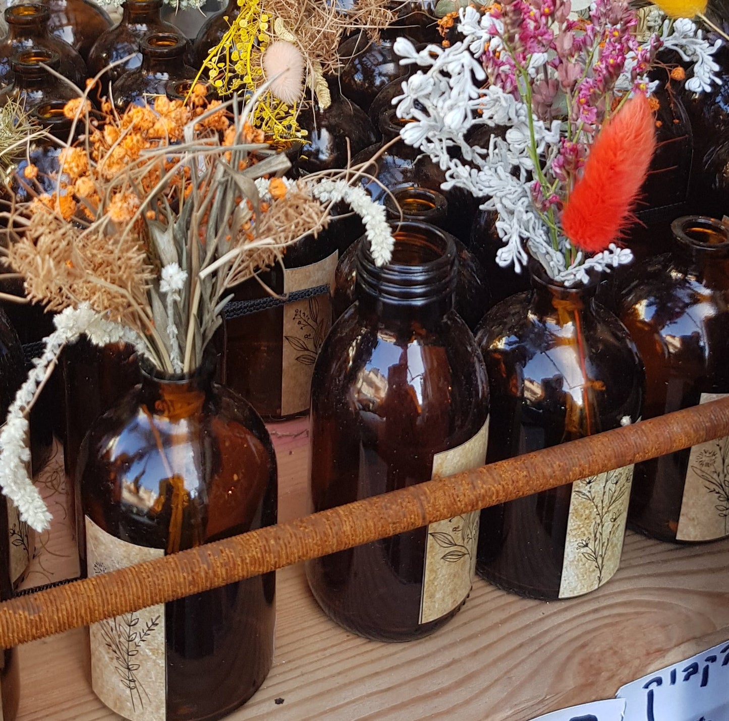 Dried flowers bouquet in a brown vintage glass bottle. - Bluenoemi