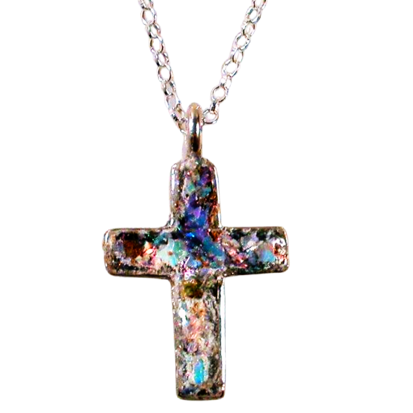 Sterling silver cross pendant set with aqua‑hued Roman glass fragment