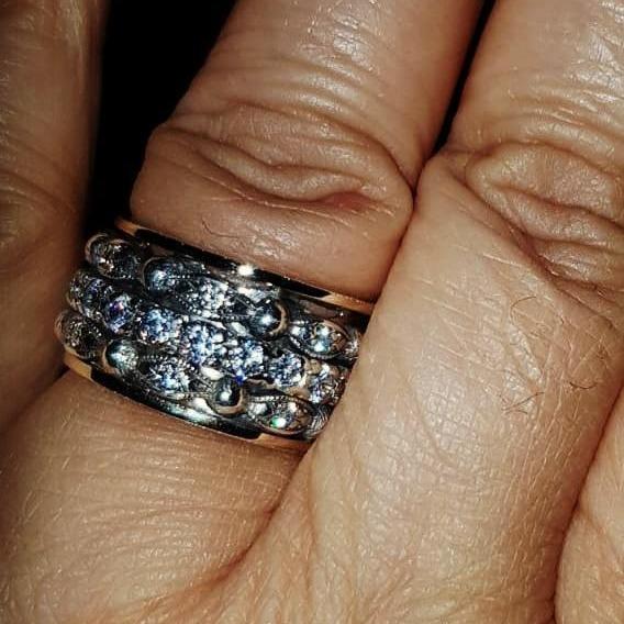 Bluenoemi rings Spinner ring for woman made of silver and gold. The ring is set with cz zircons.