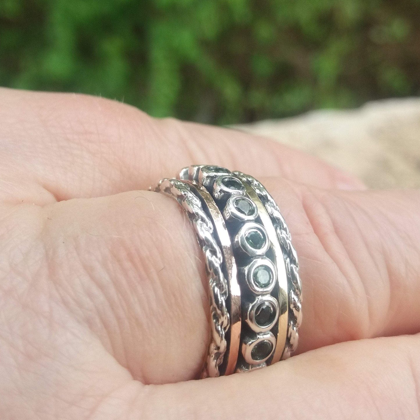 Bluenoemi rings Spinner ring for woman set with green Tourmalines. Sterling silver and gold.