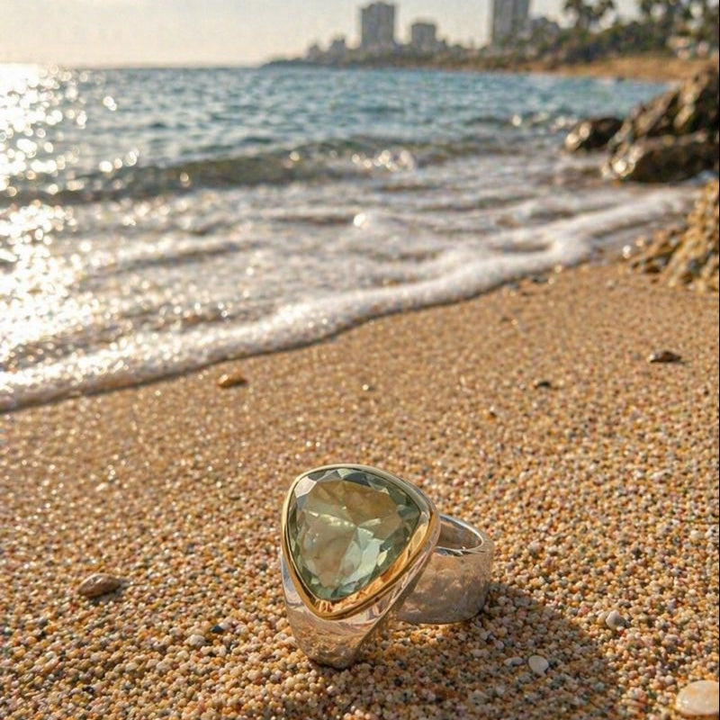 silver and gold ring with a green amethyst 