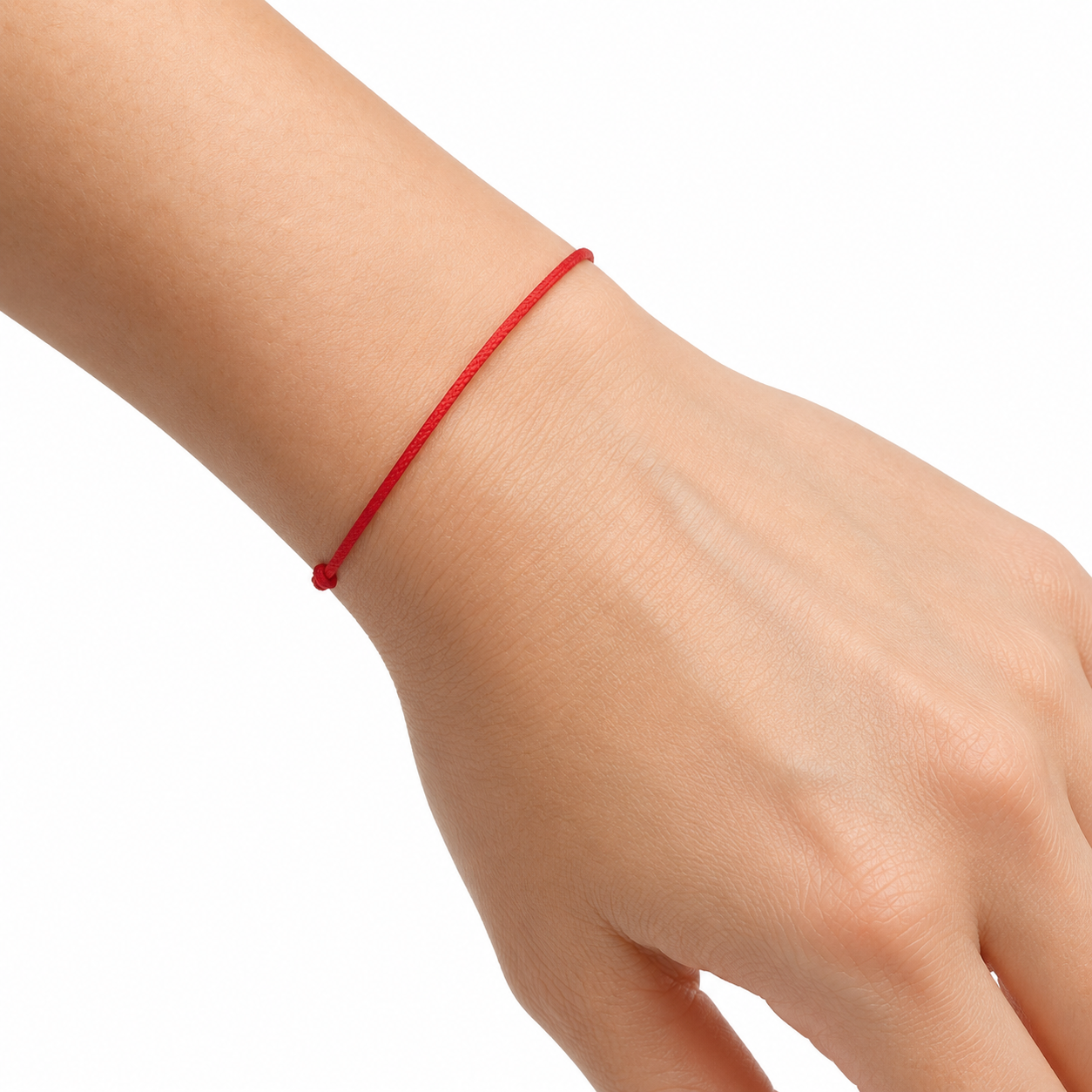 Red thread bracelet on wrist
