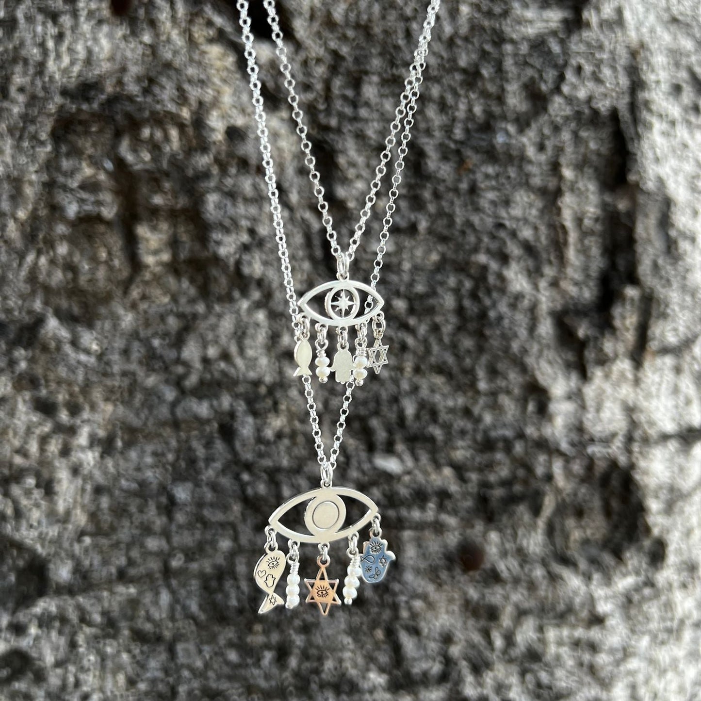 Sterling Silver Charms of Israel hanging on the protection symbol eye. Fish, Star of David, Hamsa. - Bluenoemi