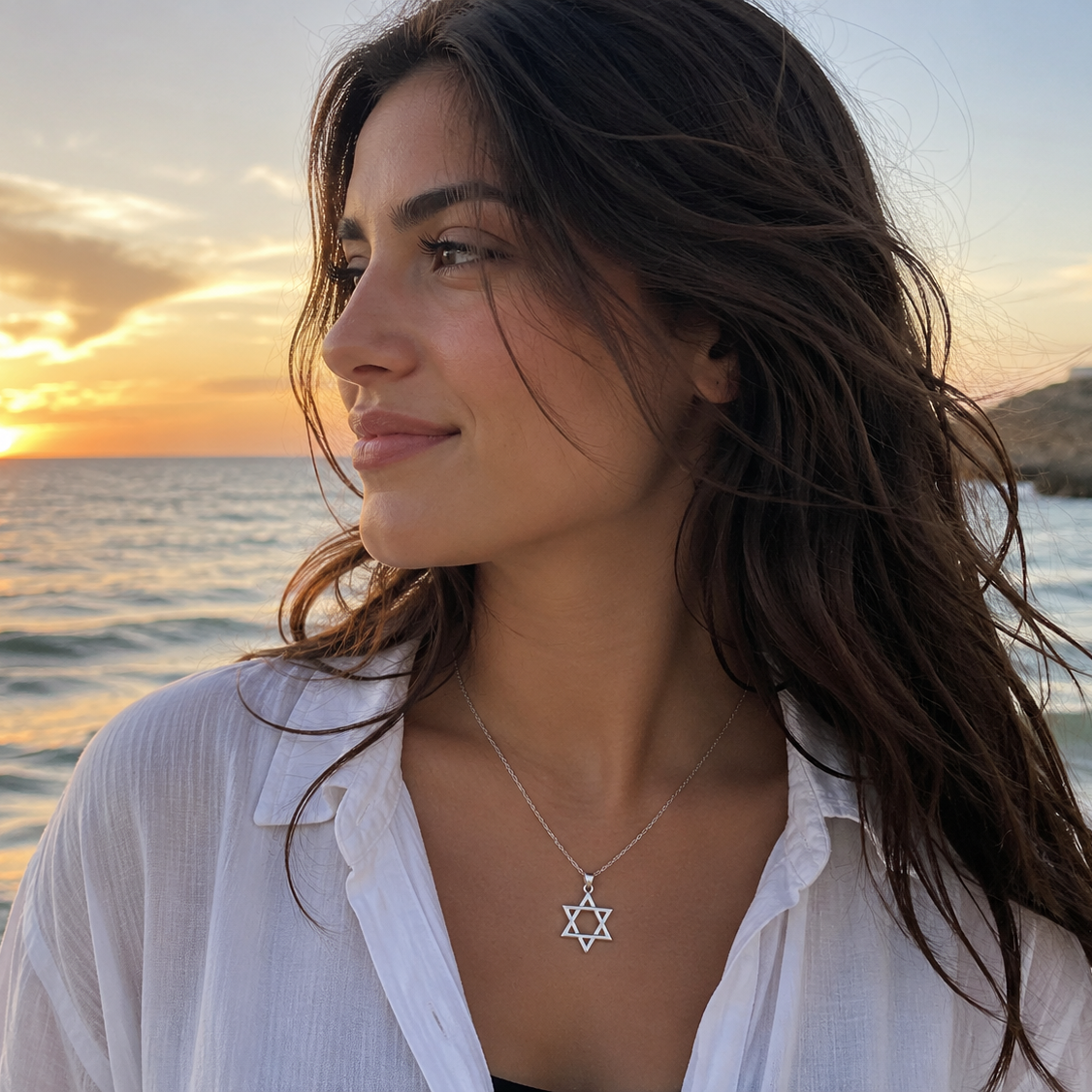 Star of David necklace on a woman near the sea