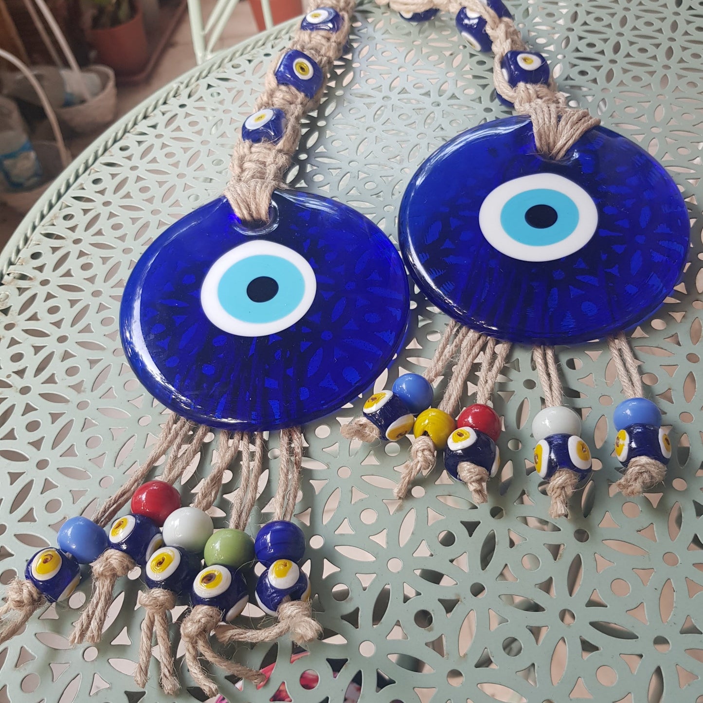 Bluenoemi Jewelry Home-Decor Blue Glass Evil Eye Souvenir Luck and Blue Eyes Symbols and beads on a rope.