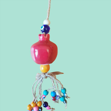 Red pomegranate and eyes decor